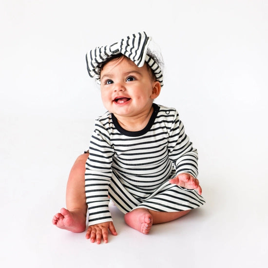 Lola & Taylor - Baby Girls Organic Cotton Charlotte Dress - Jet Black Stripe  weared by baby